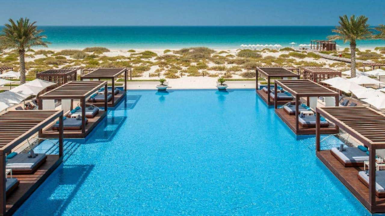 A lavish pool that joins a beach