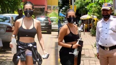 Malaika Arora trolled for choice of outfit while posing with Mumbai traffic cop