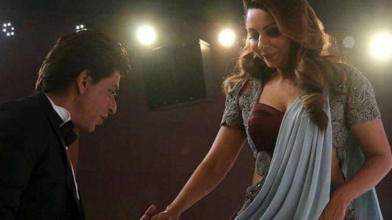 Shah Rukh Khan holds Gauri Khan's hand