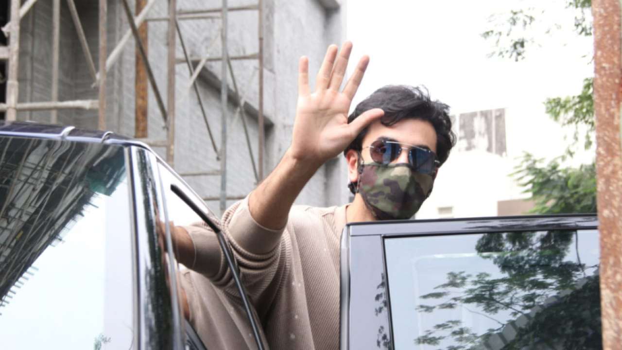 Ranbir Kapoor waves to the paparazzi.