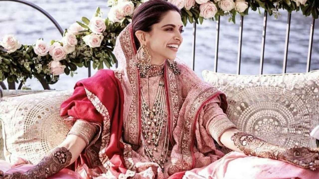 Veena Nagda applying Mehendi on Deepika Padukone's hand