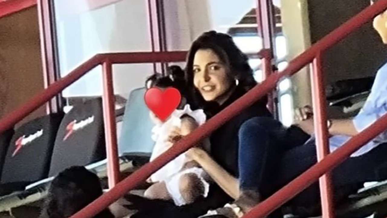 viral-sitting-in-anushka-sharma-s-lap-baby-vamika-seen-supporting-dad