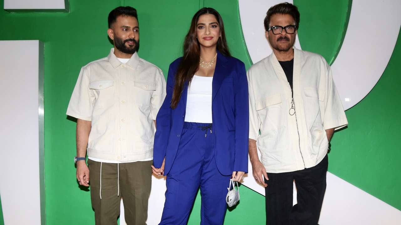 Sonam Kapoor poses with husband Anand Ahuja and dad Anil Kapoor