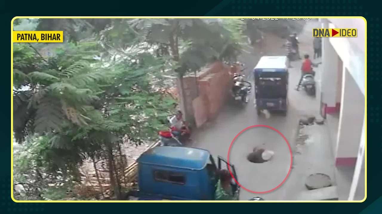 Shocking video: Woman falls into dug hole while talking on phone