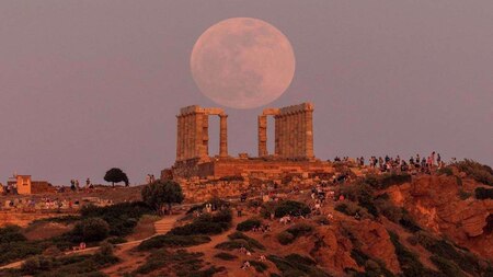 'Flower Moon' rising behind Temple of Poseidon