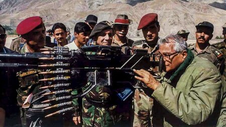 George Fernandes looking through a heavy machine gun seized from Pakistan Army - PTI Photo