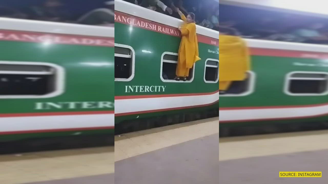 Watch: Cop spots woman trying to climb train roof 