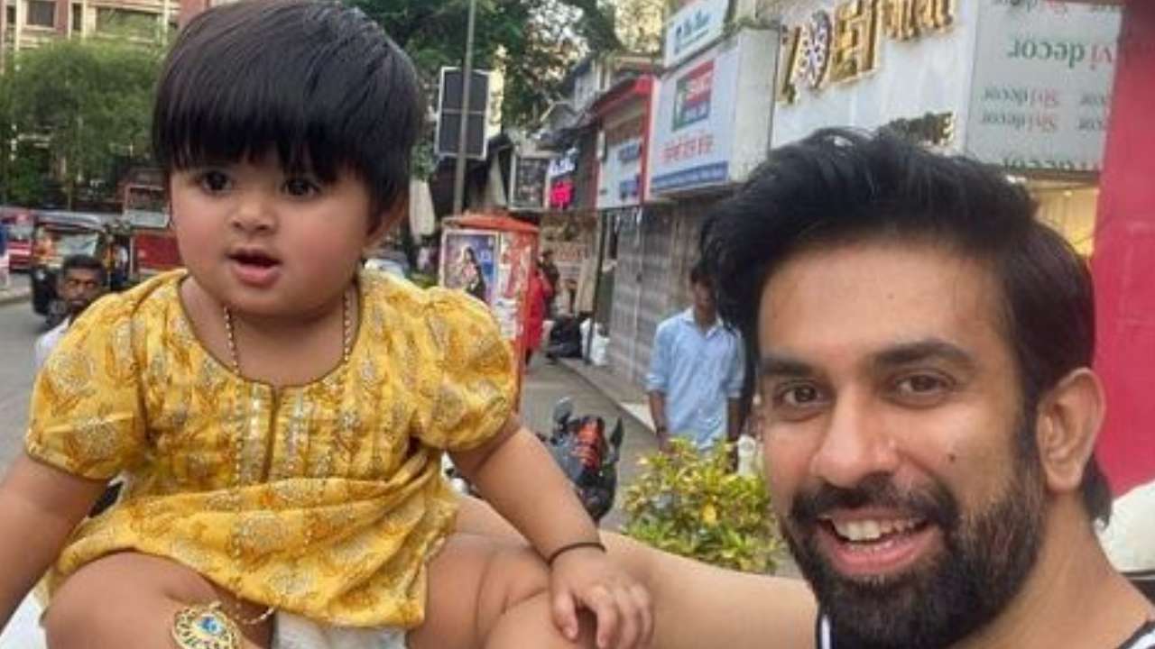 Rajeev posing with daughter