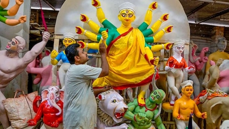 Artisan paints Goddess Durga