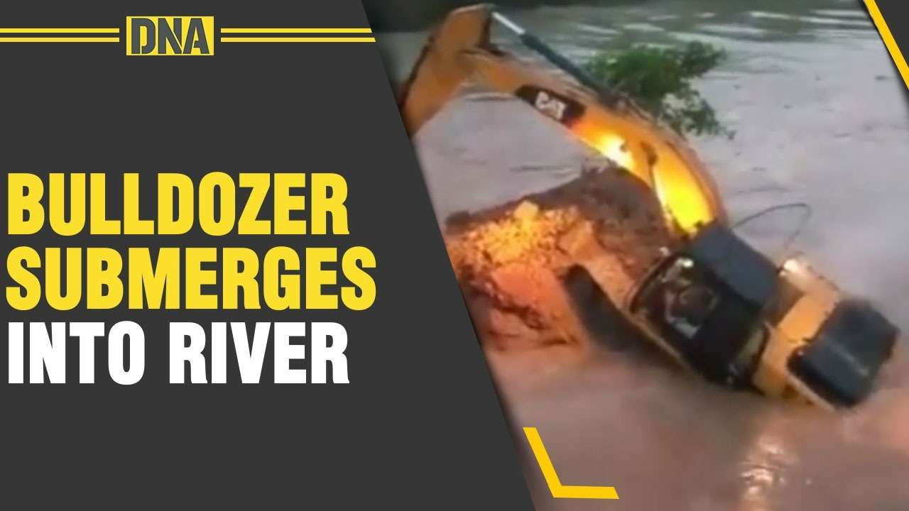 Bulldozer submerges into river while razing bridge in UP