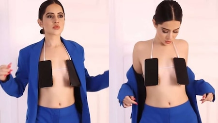 Urfi Javed covers her breasts with two mobiles