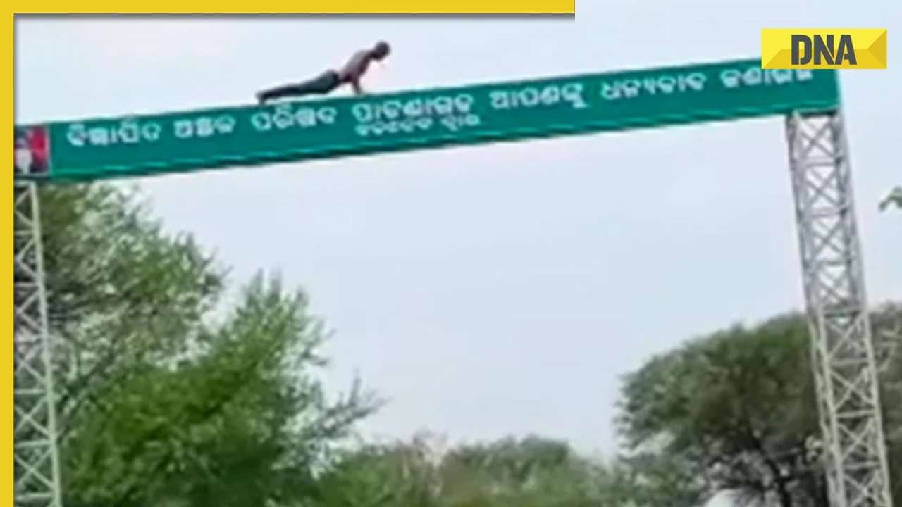 Man performs push-ups on top of a road sign in Odisha, viral video ...