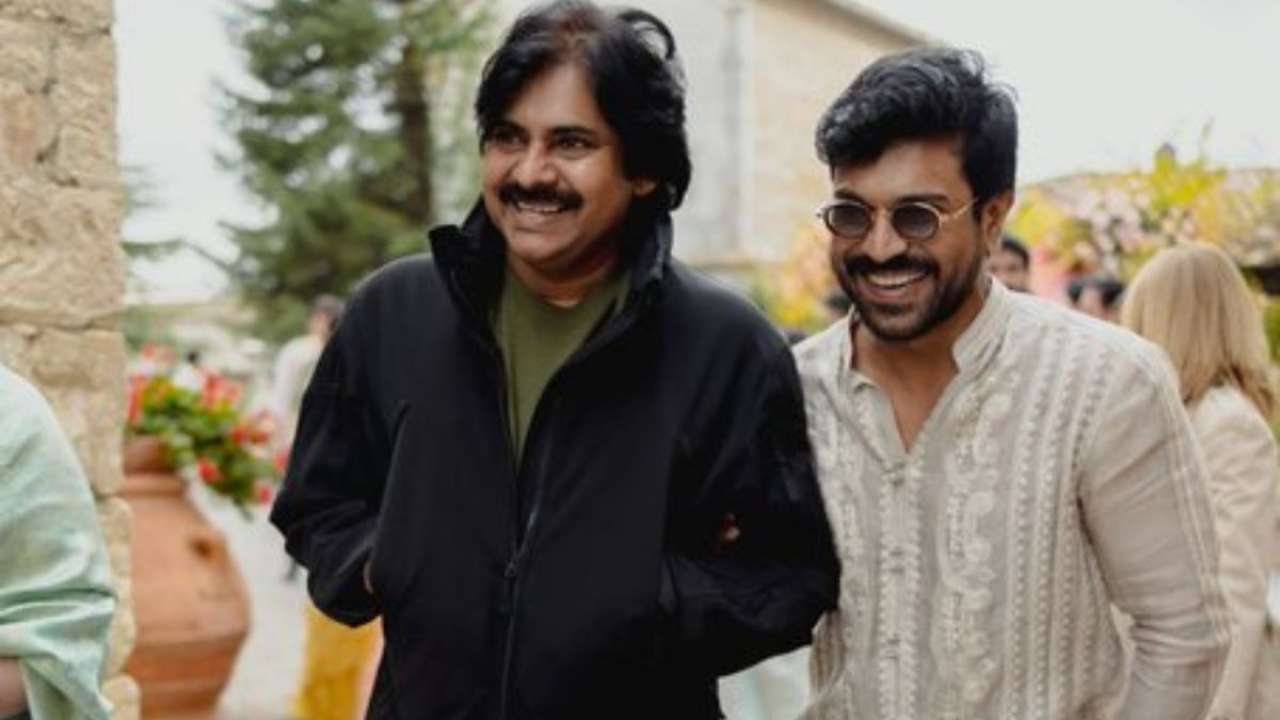 Ram Charan sharing a smile with Pawan Kalyan