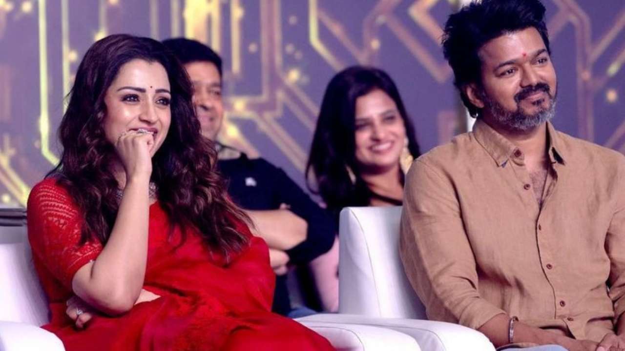 Vijay and Trisha smiling at fans' love