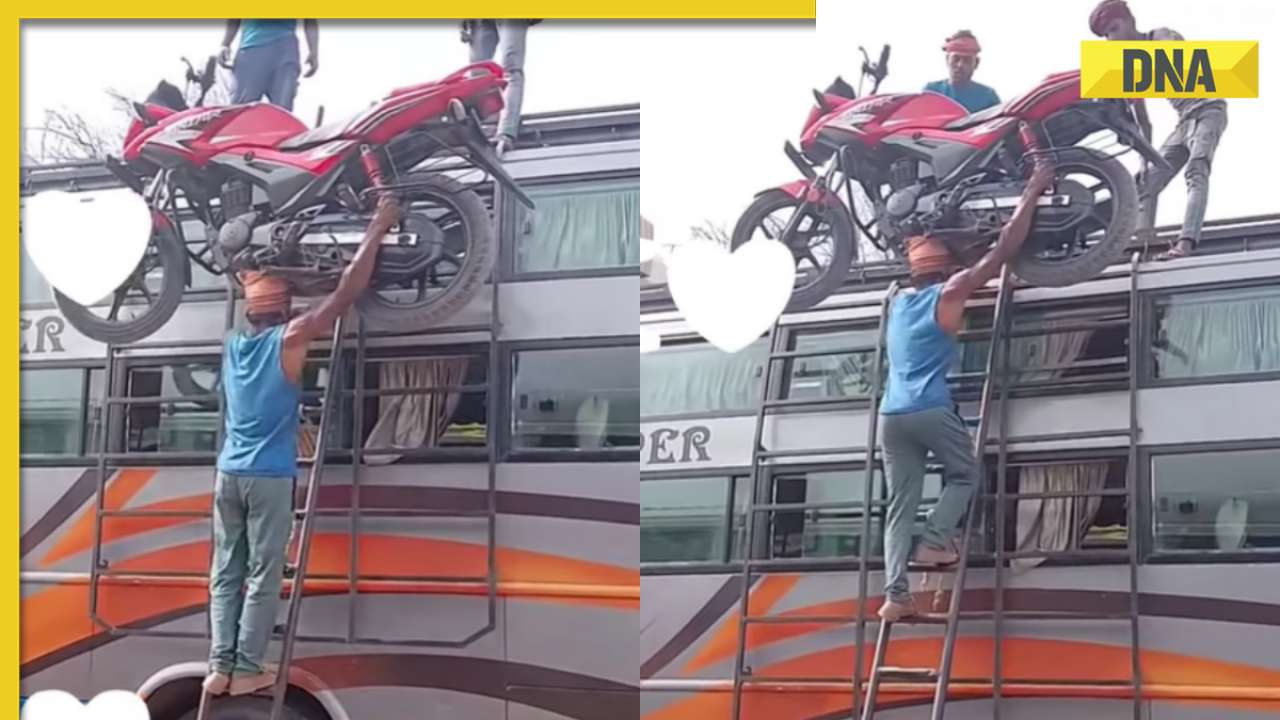Watch: Man climbs bus ladder balancing 130 kg bike on head, internet calls him 'Baahubali'