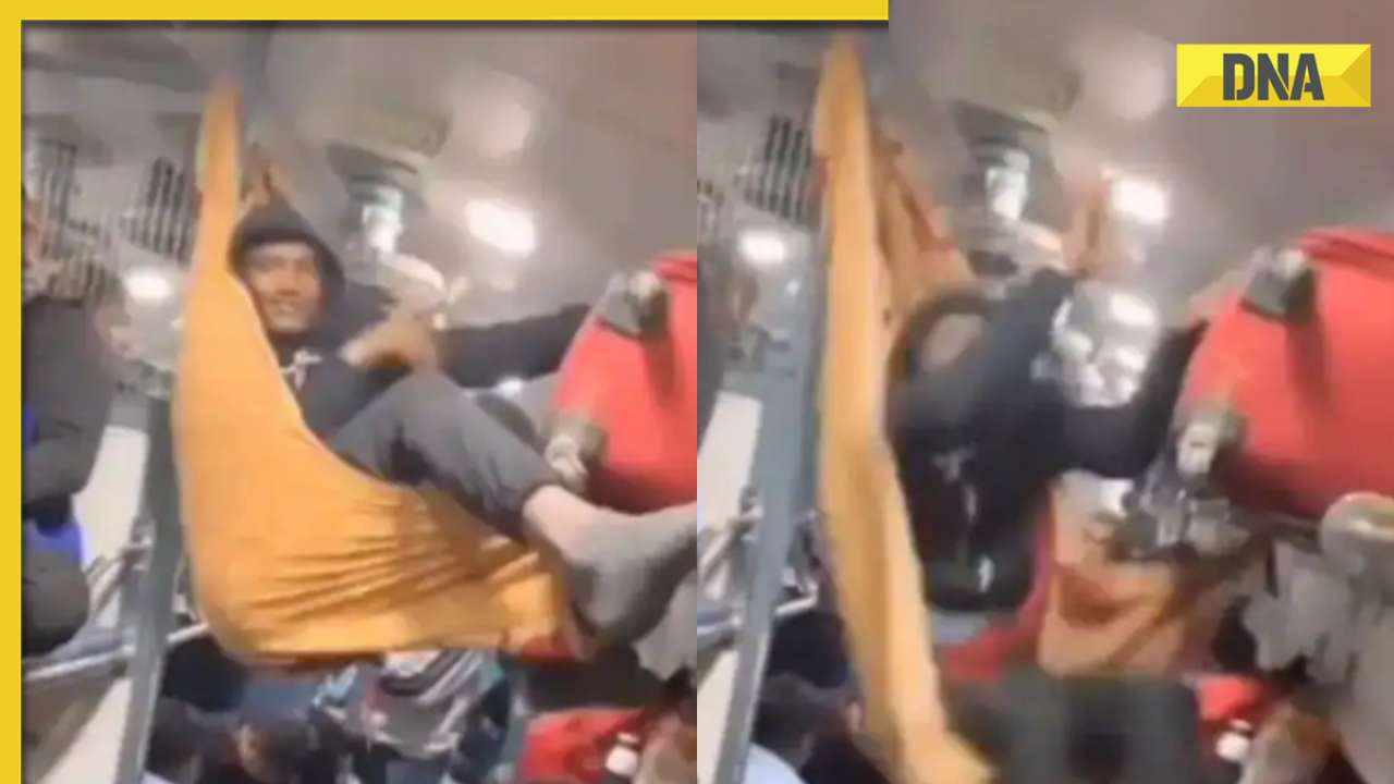 Viral video: Passenger's creative hammock attempt inside packed train ends in hilarious fall, watch