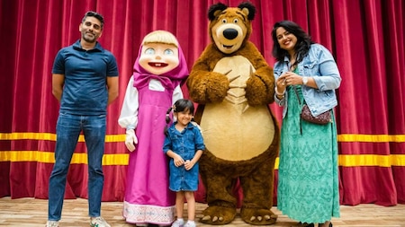 Sameera Reddy poses with Masha and the Bear with her family