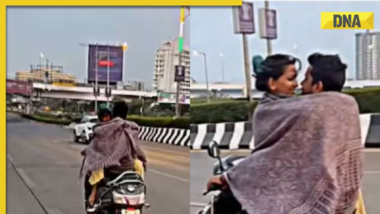 Viral video: Mumbai couple’s romance on moving scooter under blanket sparks internet backlash