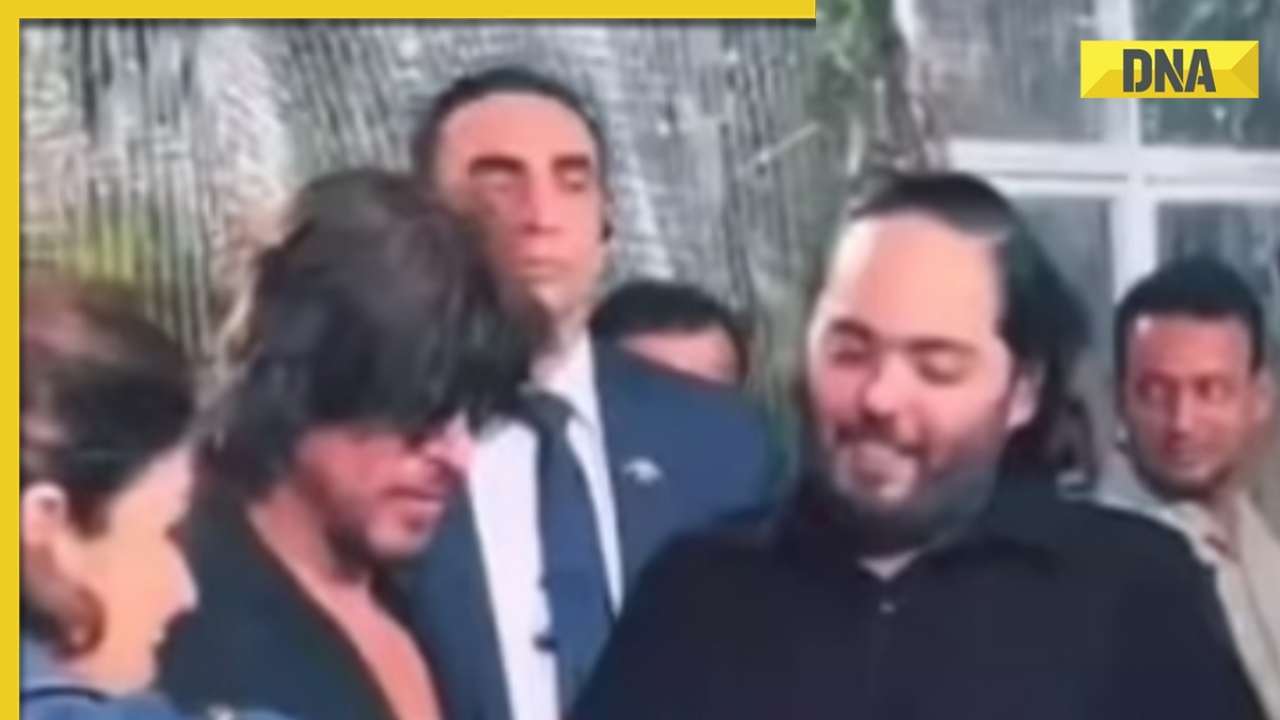 Anant Ambani hands Shah Rukh Khan a snake, Radhika Merchant can't stop laughing at Ambani bash; watch viral video
