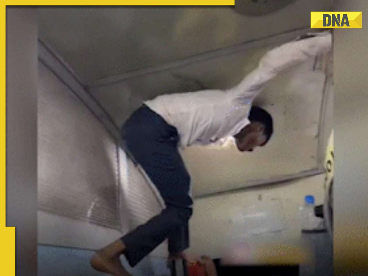 Passenger's 'spiderman' stunt in overcrowded train to reach toilet goes viral