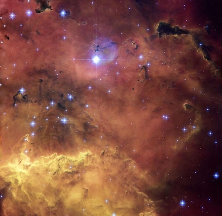 NGC 2467- A oiling cauldron of gas and dust clouds sprinkled with bright blue hot young stars