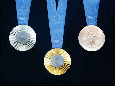 Weight of Olympic gold medal