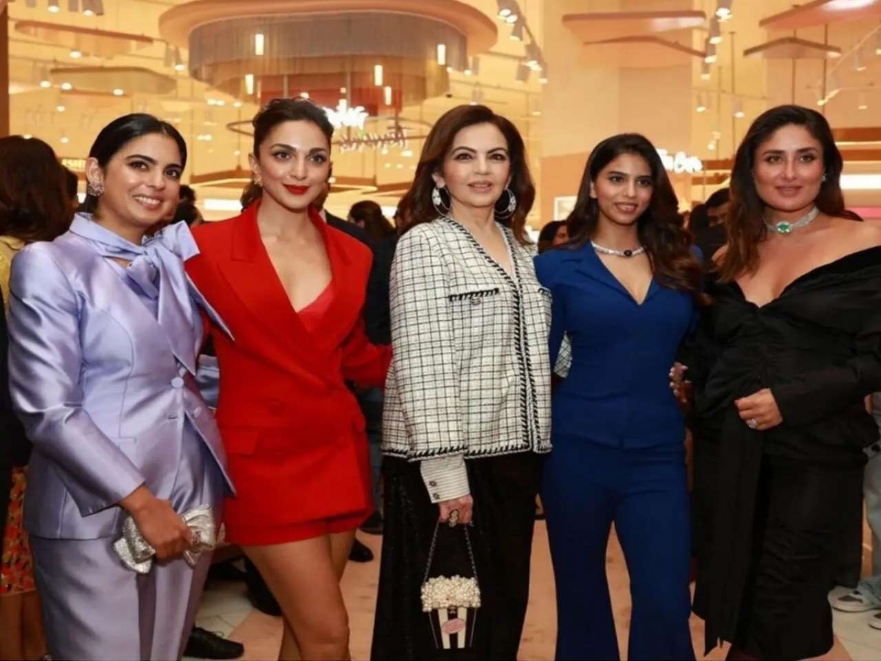 Nita Ambani and Isha Ambani pose with the faces of their brand, Tira