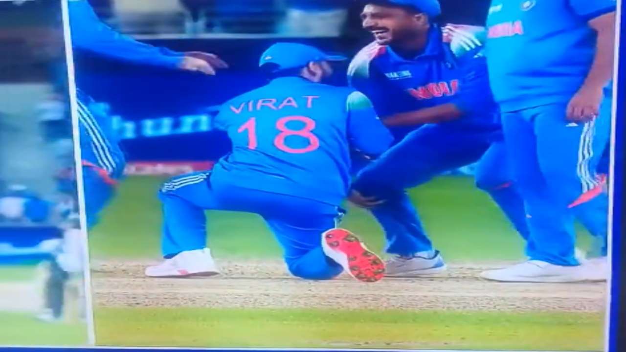 Virat Kohli touches Axar Patel's feet