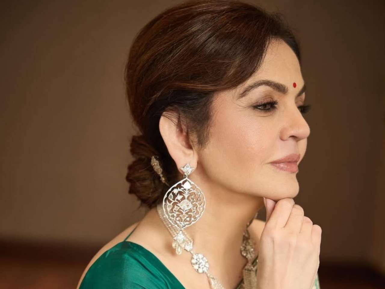 Nita Ambani shines in green Banarasi silk saree