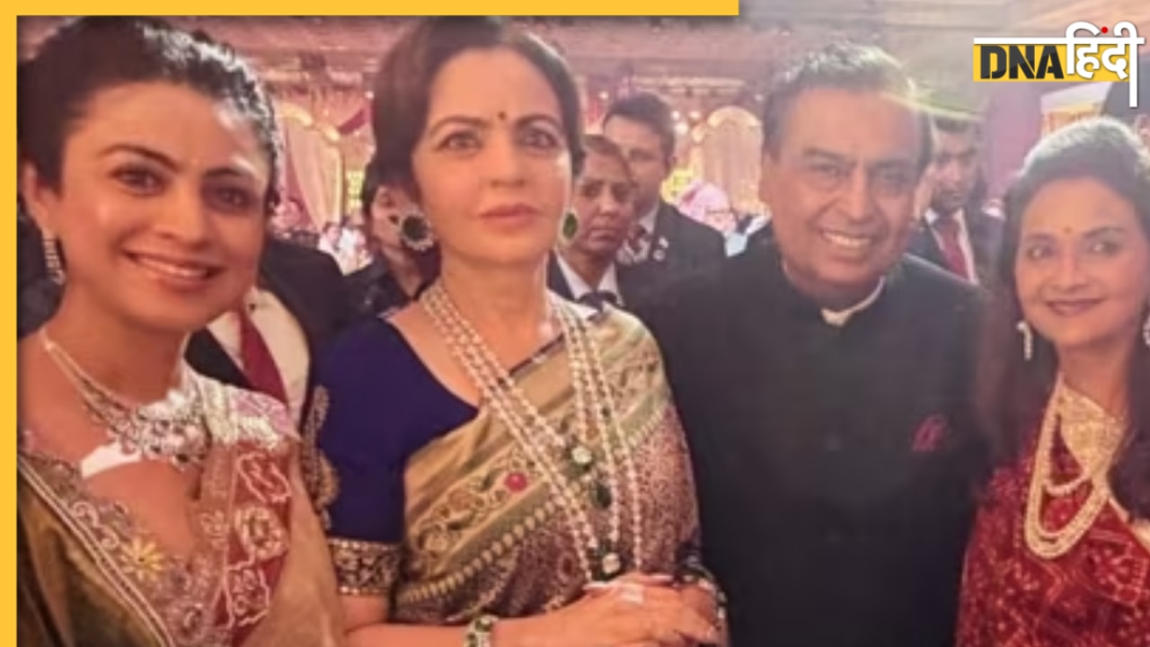 मेटैलिक ग्रे सिल्क साड़ी और स्टेटमेंट ज्वेलरी में छाईं Nita Ambani, शादी में मुकेश अंबानी संग दिए पोज; देखें खूबसूरत तस्वीरें