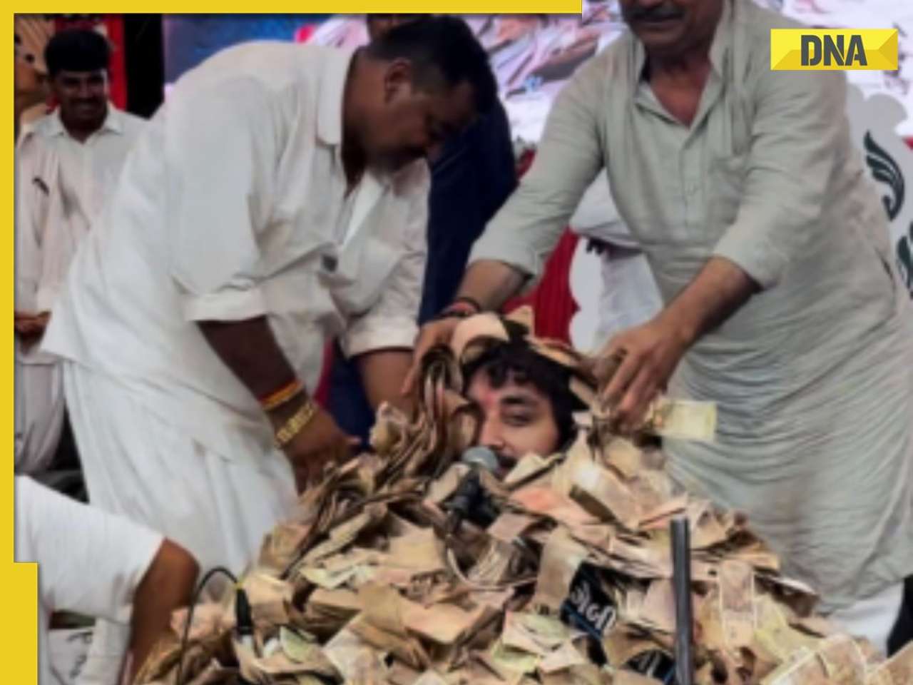 Viral Video: Gujarat Bhajan singer buried under cash as devotees shower money on stage - Watch