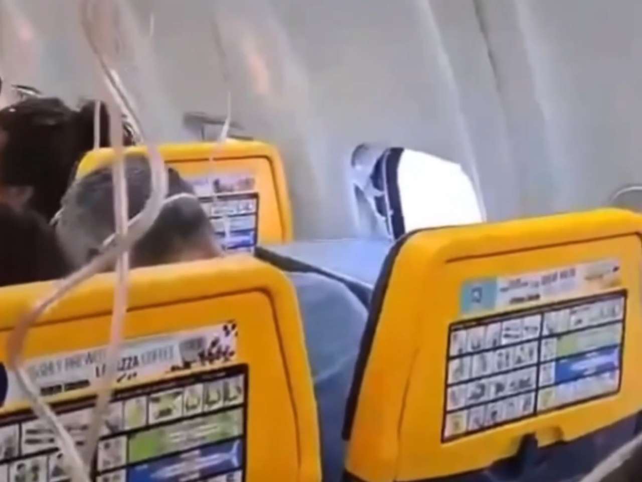 Terrifying mid-air scare: Passenger partially sucked out of plane after window comes loose; watch