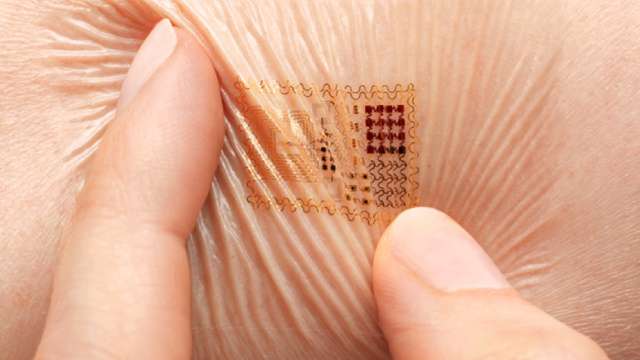 Super-thin digital display turns your skin into a screen - YouTube