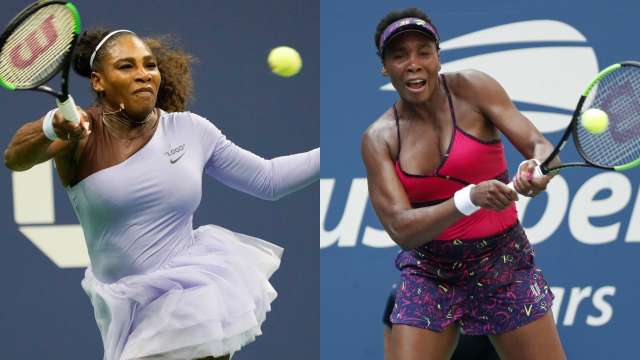 Serena Williams (L) and her elder sister Venus in action during US Open 2018