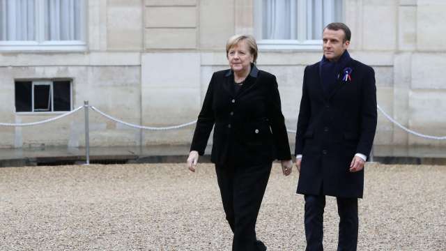 German Chancellor Angela Merkel, French President Macron arrive to attend a lunch
