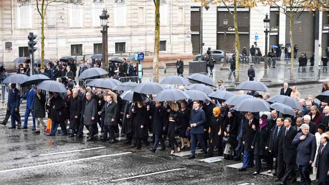 States chiefs and international representatives attend a ceremony at the Arc de Triomphe in Paris