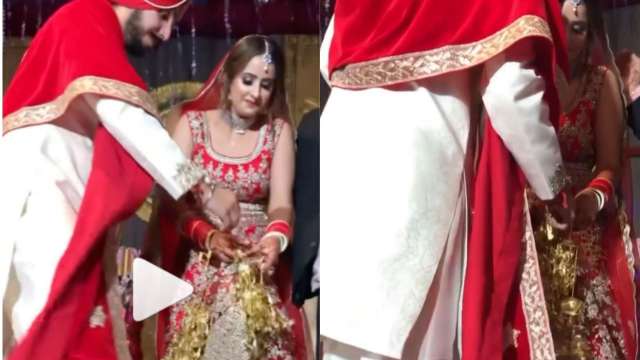 Dulha-Dulhan ka pyaar! Groom helps upset bride to remove her jewelery stuck  in lehenga - WATCH