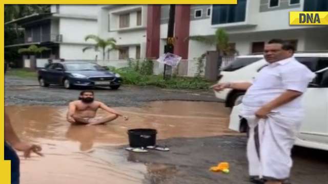 WATCH: Unique 'Pothole Protest' goes viral, Kerala man does yoga, takes mud bath in front of MLA - Vimarsana News