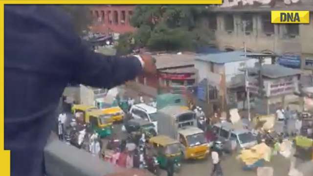 Watch: Man causes chaos on Bengaluru flyover by raining money, investigation launched - Vimarsana News