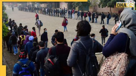 People are standing in long queue to board the metro