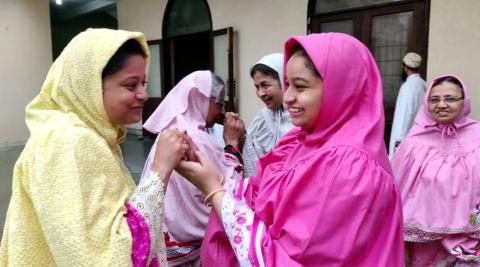 Women greeting each other on the occasion of Eid-al-Adha