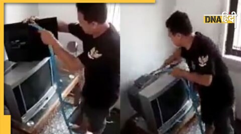 man clean tv and computer with water