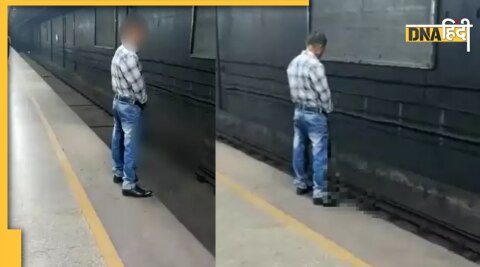 man urinating on delhi metro track