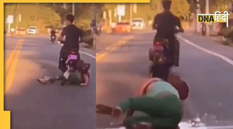 girl falls in try to kick bike rider