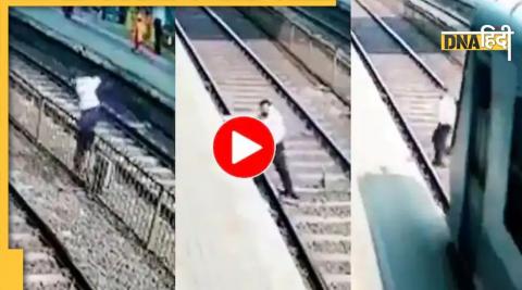 man crossing railway track