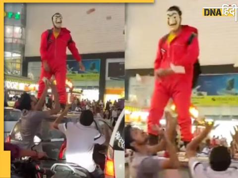 Jaipur Viral Video: नकाबपोश युवक के कार की छत पर चढ़कर नोट बरसाने से बहुत देर तक हंगामा मचा रहा.