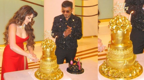 Urvashi Rautela gold birthday cake