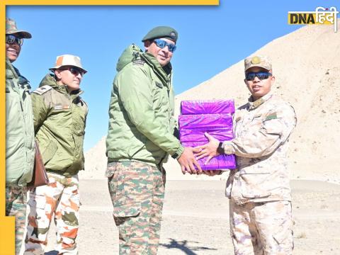 indian and chinese troops share sweets