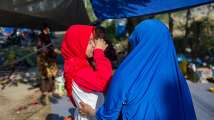 With hope and heavy heart, Indonesia struggles to handle loss as death toll...