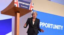  Theresa May sways to 'Dancing Queen' to deliver upbeat Brex...